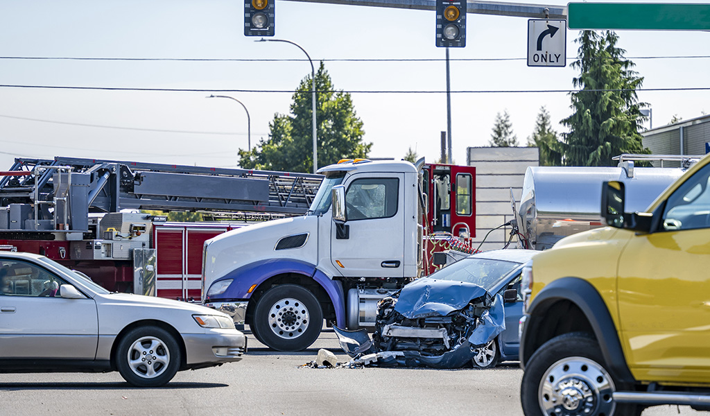Scene of a motor vehicle accident involving semi truck