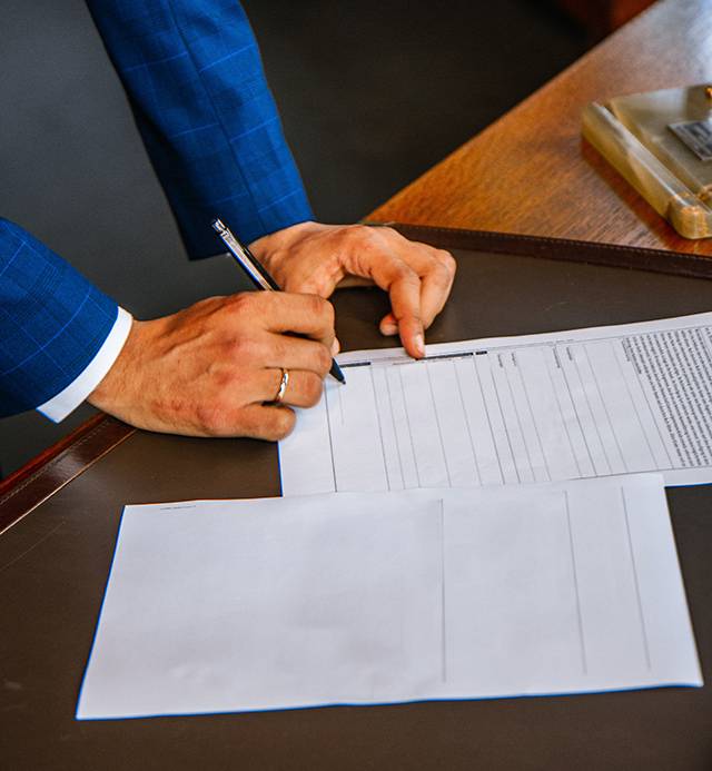 Business man signing paperwork